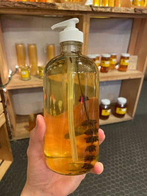 We put a sprig of fresh lavender in our 16 oz clear glass bottle of liquid honey hand soap, with white plastic pump lid.